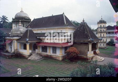 Shri Shantadurga Saunsthan is a private temple complex belonging to the Goud Saraswat Brahman Samaj located 30 km from Panaji at the foothill of Kavalem village in Ponda Taluka, Goa, India. Shrimad Swamiji of Shri Kavale Math is spiritual head Of Shree Shantadurga Saunsthan, Kavale. Shree Shantadurga temple has an impressive idol of Goddess Shree Durga. Local legends tell of a battle between Shiva and Vishnu. The battle was so fierce that the god Brahma prayed to Goddess Parvati to intervene, which she did in the form of Shantadurga. Shantadurga placed Vishnu on her right hand and Shiva on Lef Stock Photo