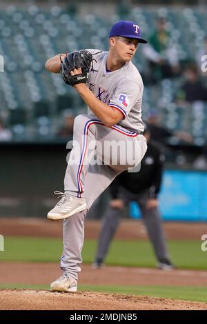 Texas Rangers starting pitcher Glenn Otto throws during the first inning of  a spring training baseball game against the Seattle Mariners Monday, March  28, 2022, in Peoria, Ariz. (AP Photo/Charlie Riedel Stock