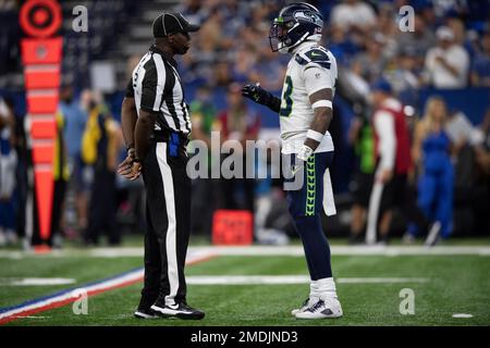 Officials pose before an NFL football game between the Los Angeles Rams and  the Las Vegas Raiders, Thursday, Dec. 8, 2022, in Inglewood, Calif. They  are, from left, replay official Bob Hubbell