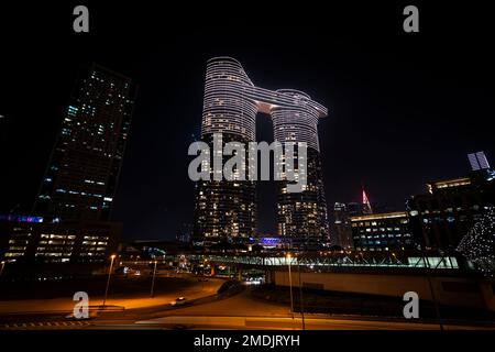 Dubai, UAE , United Arab Emirates. November 28th, 2022: Beautiful modern skyscraper against a blue sky with a viewing platform on the roof. Stock Photo