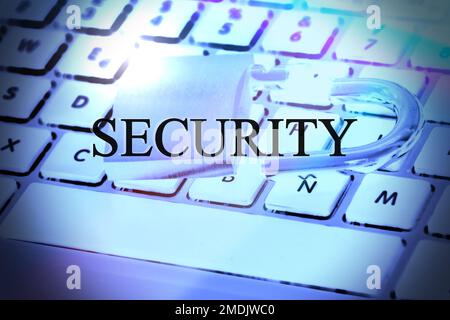 Security text on computer keyboard with open padlock Stock Photo