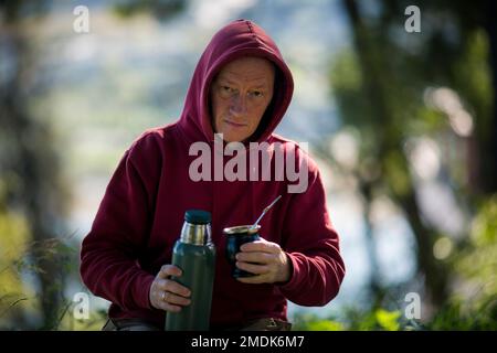 Portrait of a man drinks Mate in the Park. Stock Photo