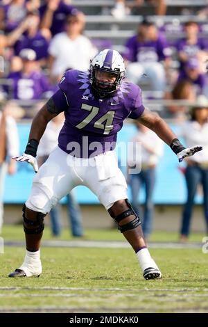 TCU offensive tackle Andrew Coker (74) defends against the rush by ...