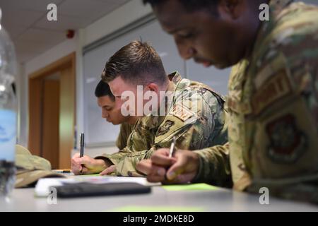 Senior Airman Ricardo Puente,(left), 726th Air Mobility Squadron crew chief, Staff Sgt. Shawn Reinsel (center), 726th Air Mobility Squadron passenger service agent, and Staff Sgt. Gerdon Jacobs (right), 726th Air Mobility Squadron aircraft services, participate in a group exercise that involves three rounds of impromptu networking on Spangdahlem Air Base, Germany, July 25, 2022. The Project Mercury Innovator Workshop aimed to help Airmen build their innovation capacity, equipping them with the tools they need to continue problem solving as innovators. Stock Photo