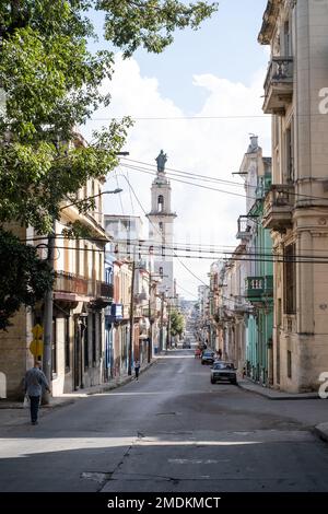 View along Neptuno, Havana, Cuba, with Iglesia y Convento de Nuestra Señora del Carmen visible to the left of centre. Stock Photo