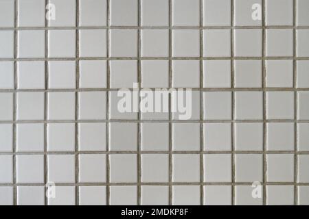 Small white ceramic tiles pattern as background Stock Photo