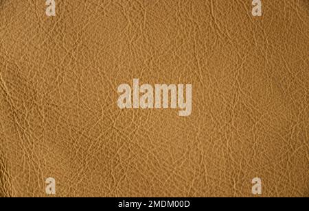 light beige background from genuine leather, solid beige background close-up Stock Photo