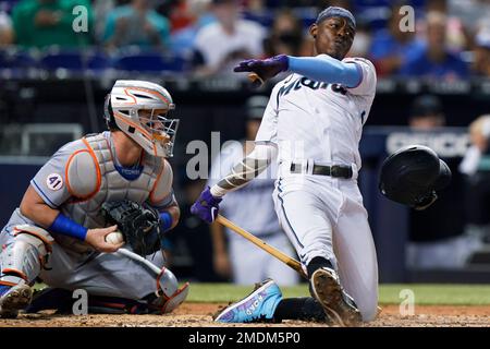 Miami Marlins' Jazz Chisholm loses his helmet as he runs to first base with  a single during the first inning of a baseball game against the New York  Yankees, Sunday, Aug. 1