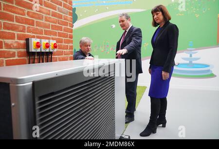 Labour party leader Sir Keir Starmer and Rachel Reeves, shadow chancellor of the Exchequer, are shown a heat pump demonstrator by Octopus Energy CEO and founder Greg Jackson during a visit to renewable energy company, Octopus Energy, in Slough, East Berkshire, as the Party sets out plans to support households and businesses with rising energy bills. Picture date: Monday January 23, 2023. Stock Photo
