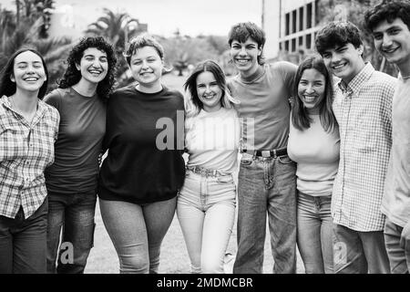 Young group of friends having fun outdoor with university on background -  Focus on center faces - Black and white editing Stock Photo - Alamy