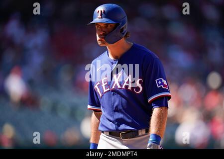 Texas Rangers designated hitter DJ Peters (38) reacts after flying out to  center field during the