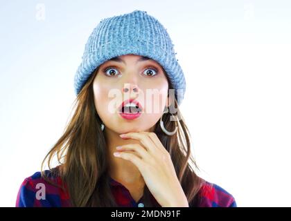 I cant believe it. Studio shot of a beautiful young woman gasping against a white background. Stock Photo