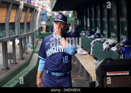 Chicago Cubs bench coach Andy Green, left, wearing a face mask, talks with  Codi Heuer before a baseball game against the Pittsburgh Pirates Friday,  Sept. 3, 2021, in Chicago. Green will skipper