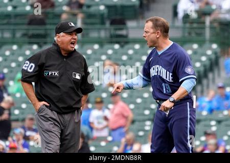 Chicago Cubs bench coach Andy Green, left, wearing a face mask, talks with  Codi Heuer before a baseball game against the Pittsburgh Pirates Friday,  Sept. 3, 2021, in Chicago. Green will skipper