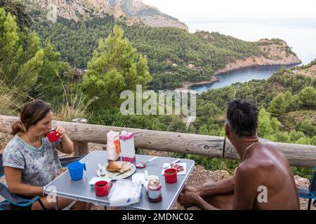 Father and daughter having breakfast in a motor home. Stock Photo