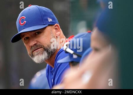 White Sox manager Tony La Russa (22) and Cubs manager David Ross (3) share  a moment before the start of a game at Wrigley Field on Aug. 6, 2021.  (Photo by Chris