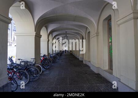 BERN, SWITZERLAND, JUNE 23, 2022 - Arcades with parked bicycles in the center of Bern, Switzerland Stock Photo