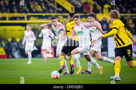 Dortmund, Germany. 22nd Jan, 2023.  Jeffrey Gouweleeuw (FCA), Jude Bellingham (BVB), Arne Engels, Elvis Rexhbecaj (FCA) Borussia Dortmund - FC Augsbur Stock Photo