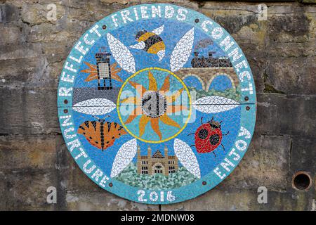 A mosaic plaque in a community garden commemorates its founding, in 2016. In Wharton Park in the city of Durham, County Durham UK Stock Photo