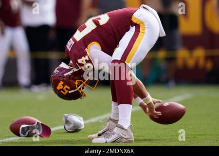 Washington Commanders long snapper Camaron Cheeseman (54) reacts during the  second half of an NFL football game against the Chicago Bears, Thursday,  Oct. 13, 2022, in Chicago. (AP Photo/Kamil Krzaczynski Stock Photo - Alamy