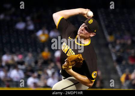 As San Diego Padres batter Mark Loretta, front, beats out his