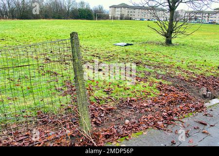 Glasgow, Scotland, UK 23rdJanuary, 2023. Van crashes through sports field wire and into the side of the forth and clyde canal at Blairdardie on great western road. The torn up wire wall and concrete posts were intersected by train tracks in the soft football pitch credit  Gerard Ferry/Alamy Live News Stock Photo