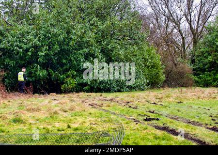 Glasgow, Scotland, UK 23rdJanuary, 2023. Van crashes through sports field wire and into the side of the forth and clyde canal at Blairdardie on great western road. The torn up wire wall and concrete posts were intersected by train tracks in the soft football pitch credit  Gerard Ferry/Alamy Live News Stock Photo
