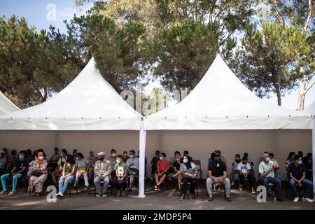 School students and their parents wait to receive their COVID-19 vaccines  as Morocco launches a campaign to vaccinate 12-17 year olds before the  start of the school year, in Rabat, Morocco, Tuesday