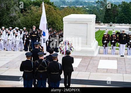 (Row behind color guard, left to right) Maj. Gen. Allan M. Pepin, commanding general, Joint Task Force - National Capital Region; Lee Hunseung, member of parliament, National Assembly of the Republic of Korea; and Lee Jong-sup, minister of national defense, Republic of Korea; render honors during an Armed Forces Full Honors Wreath-Laying Ceremony at the Tomb of the Unknown Soldier at Arlington National Cemetery, Arlington, Va., July 26, 2022. Stock Photo