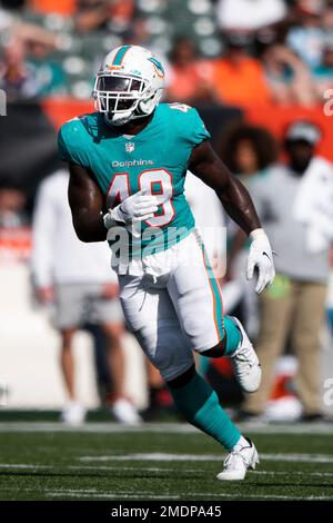 Miami Dolphins linebacker Calvin Munson talks to fans after a loss to ...