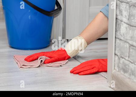 man mopping the floor with a rag. wet house cleaning. woman mopping the floor. Stock Photo