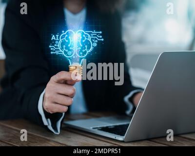 Artificial intelligence technology concept. Glow digital light bulb graphics with AI brain system inside, hold by business person. Creative innovation Stock Photo