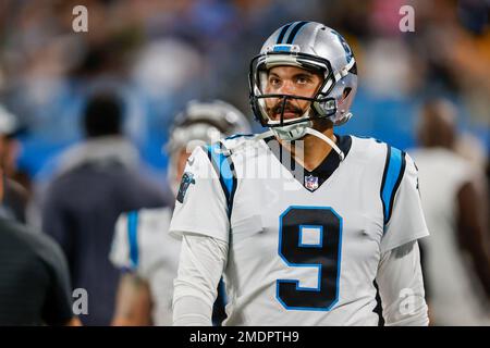 Carolina Panthers kicker Ryan Santoso wears a 9/11 FDNY hat during