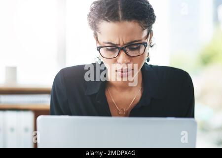 I cant afford to face any challenges right now. a young businesswoman looking stressed out while working in an office. Stock Photo