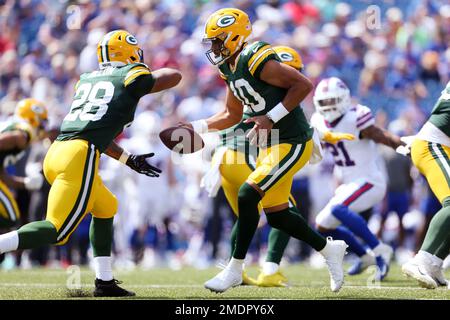 AJ Dillon of the Green Bay Packers warms up before the game