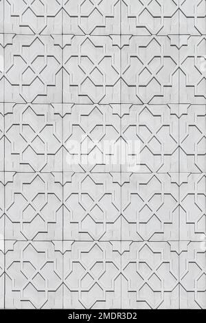 Texture of a wall covered with white decorative  tiles. Abstract background for design. Stock Photo