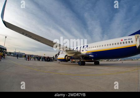 April 24 2022- Naples Italy Travellers board the RyanaIr plane to take off to their destination Stock Photo