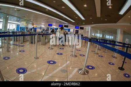 April 22 2022- Naples Italy Passengers wait at the airport at boarding to pass through filters Stock Photo
