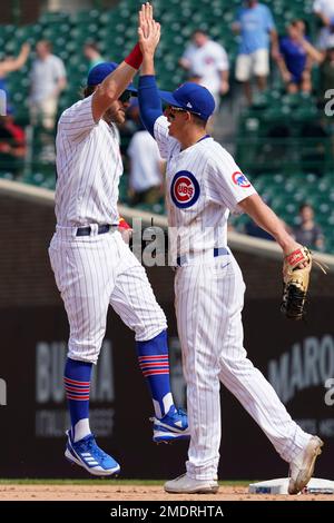 Chicago Cubs' Patrick Wisdom, right, celebrates with Anthony Rizzo