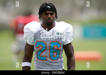 August 19, 2023: Miami Dolphins running back Salvon Ahmed (26) carries the  ball as Houston Texans safety Jimmie Ward (1) looks on after missing a  tackle during an NFL preseason game between