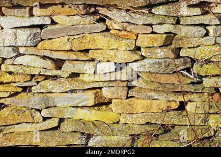 Drystone wall in the countryside. Wall made from local stones and erected without any cementing. Stock Photo
