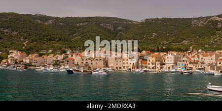 KOMIZA, CROATIA, EUROPE - Panorama of harbor, coastal town of Komiza, on the island of Vis, in the Adriatic Sea. Stock Photo