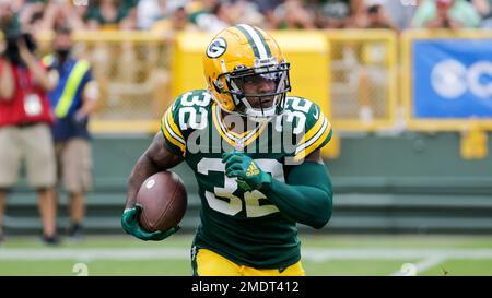 Kylin Hill of the Green Bay Packers runs for a touchdown in the