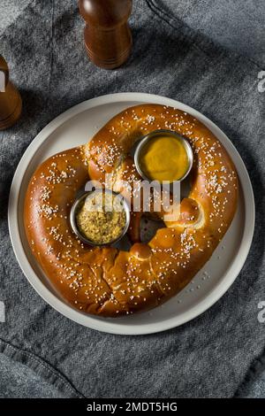Homemade Huge Giant Soft German Pretzel with Mustard Stock Photo