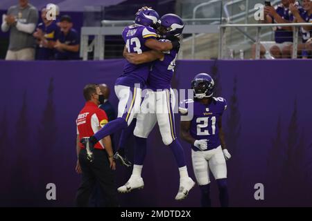 Minnesota Vikings linebacker Troy Dye (45) got his arms around the ankle of  Chicago Bears wide receiver Dazz Newsome (83) in the third quarter Sunday,  Jan. 9, 2022 at U.S. Bank Stadium