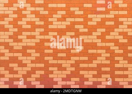 Texture of a wall covered with decorative brick-like tiles. Abstract background for design. Stock Photo