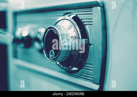 closeup rotation dial number key lock on safe box for security code image concept Stock Photo