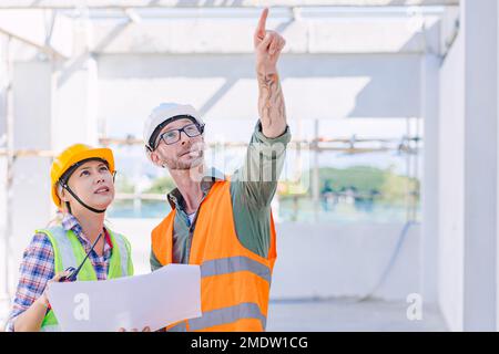 engineer worker team builder working together teamwork talking together work at construction site Stock Photo