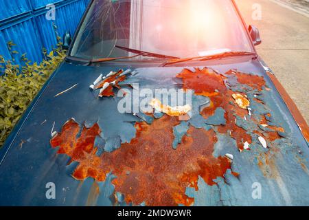 Old Car color bad painting crack. Peeling Paint with rust metal auto part surface Weathering decay Stock Photo