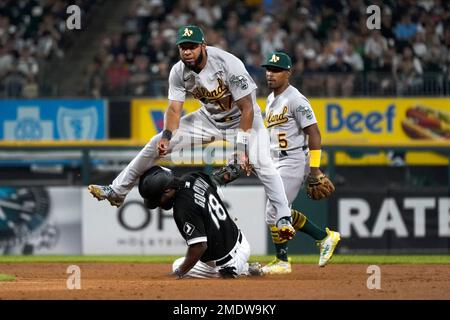 Oakland Athletics' Tony Kemp (5) watches shortstop Elvis Andrus turn the  double play, forcing Chicago White Sox's Brian Goodwin out at second and  getting Andrew Vaughn at first, during the seventh inning